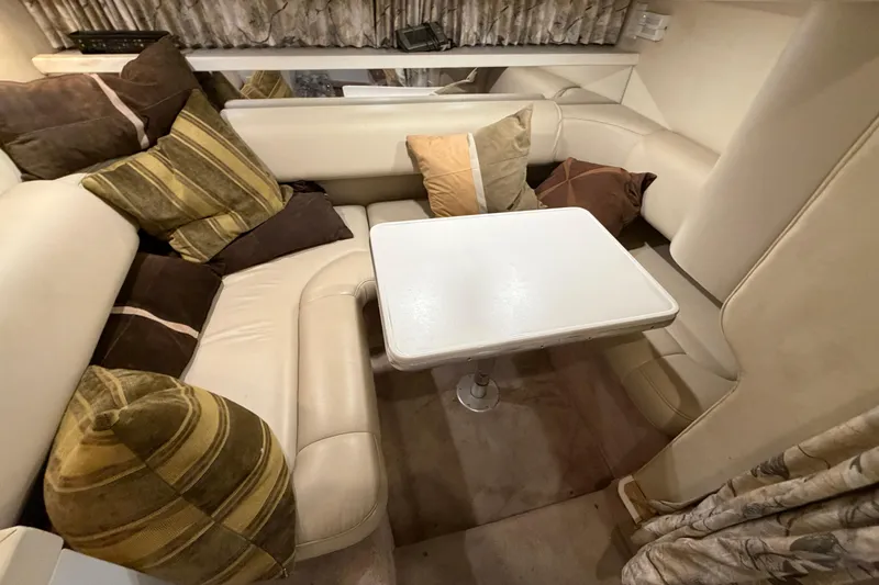 Slide: The Image of Interior of a 1998 Formula 34 Performance Cruiser with cozy seating and cushions. - 29