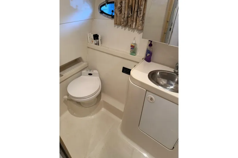 Slide: The Image of Bathroom interior of 1998 Formula 34 Performance Cruiser with toilet and sink. - 33