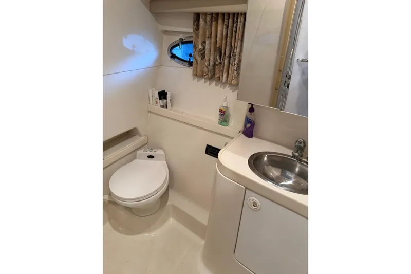 Slide: The Image of Bathroom interior of 1998 Formula 34 Performance Cruiser with toilet and sink. - 34