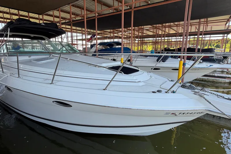 Slide: The Image of 1998 Formula 34 Performance Cruiser docked in a marina, side view. - 4