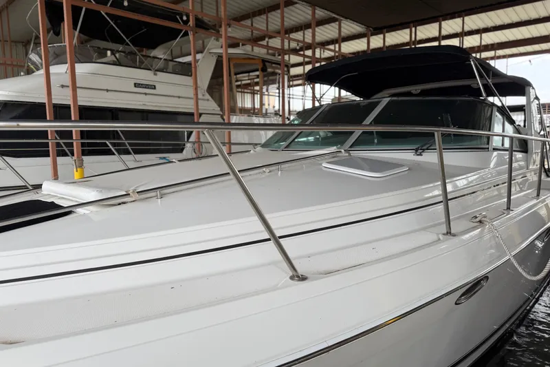 Slide: The Image of 1998 Formula 34 Performance Cruiser docked in a covered marina, showcasing sleek design. - 8