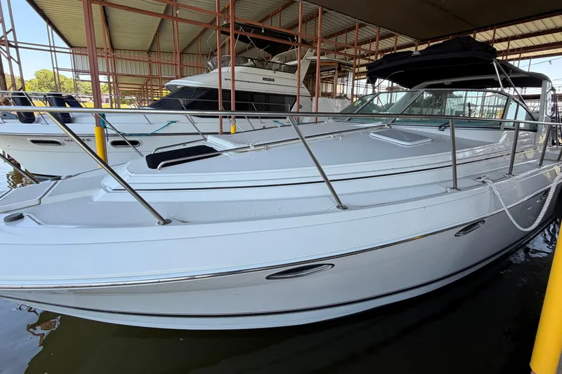 Slide: The Image of 1998 Formula 34 Performance Cruiser docked in a covered marina. - 9