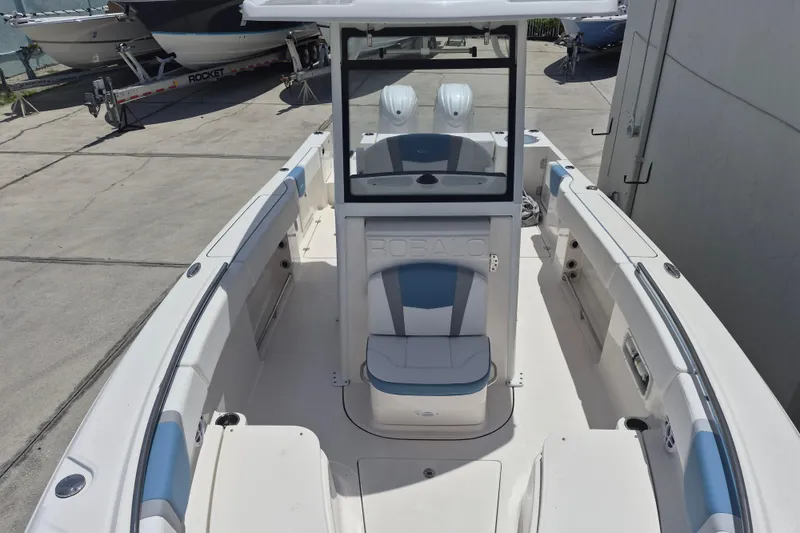 Slide: The Image of 2026 Robalo R250 Center Console boat with spacious seating and modern design. - 10