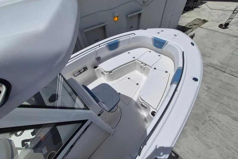 Slide: The Image of 2026 Robalo R250 Center Console boat with spacious seating and storage compartments. - 12