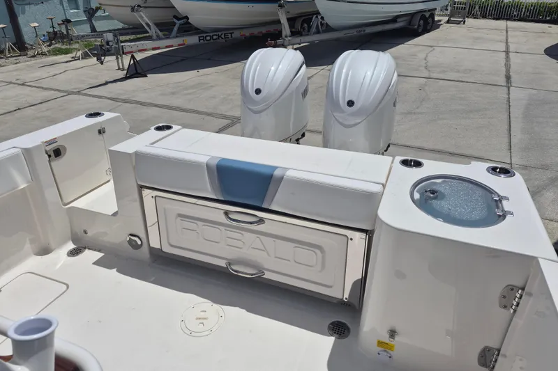 Slide: The Image of 2026 Robalo R250 Center Console boat with dual engines and seating area. - 17