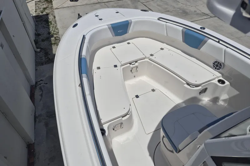 Slide: The Image of 2026 Robalo R250 Center Console boat interior with seating and storage compartments. - 9