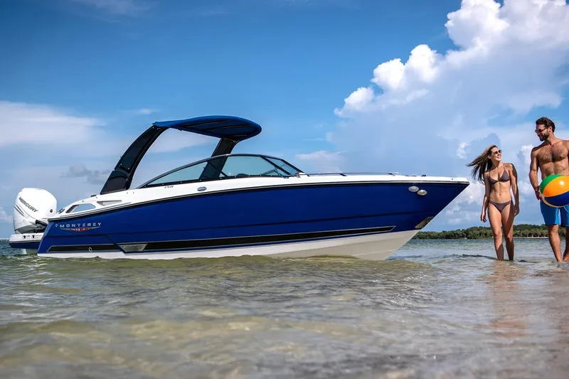 The Image of 2026 Monterey 275SS Super Sport boat on a sunny beach with a couple nearby. - 0