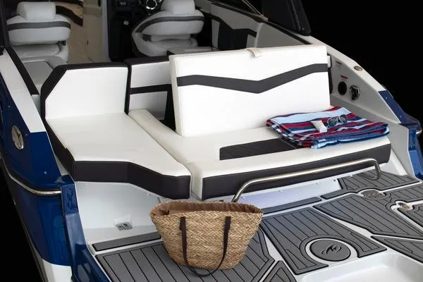Slide: The Image of Manufacturer Provided Image: 2025 Monterey 275SS Super Sport boat interior with seating, striped towels, and woven basket. - 5