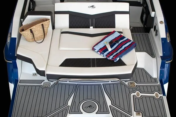 Slide: The Image of Manufacturer Provided Image: 2025 Monterey 275SS Super Sport boat interior with seating, towel, and bag on deck. - 6