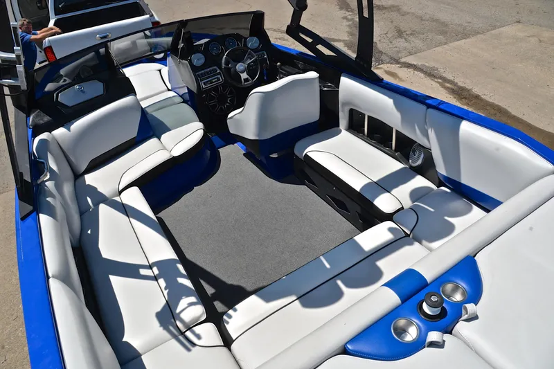 Slide: The Image of Interior of a 2014 Axis A22 boat with white and blue seating. - 23