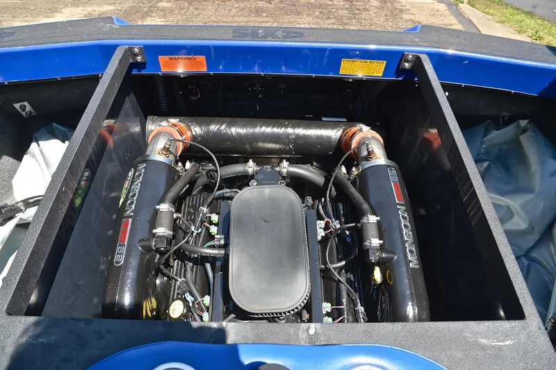 Slide: The Image of Engine compartment of a 2014 Axis A22 boat, featuring a Monsoon 350 engine. - 26