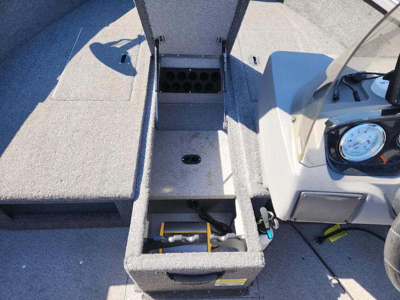 Slide: The Image of 2020 Crestliner 1650 Fish Hawk with open storage and dashboard view. - 17