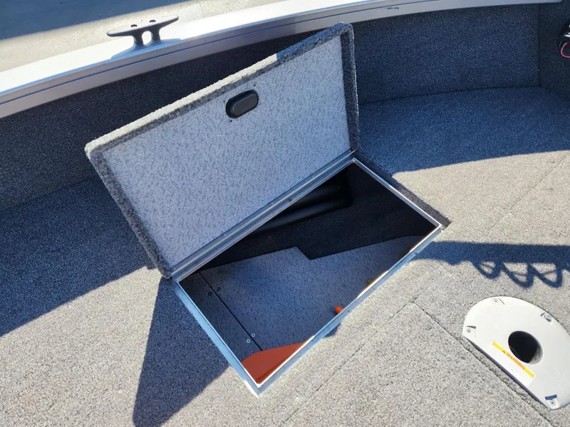 Slide: The Image of Crestliner 1650 Fish Hawk 2020 storage compartment with open lid. - 19
