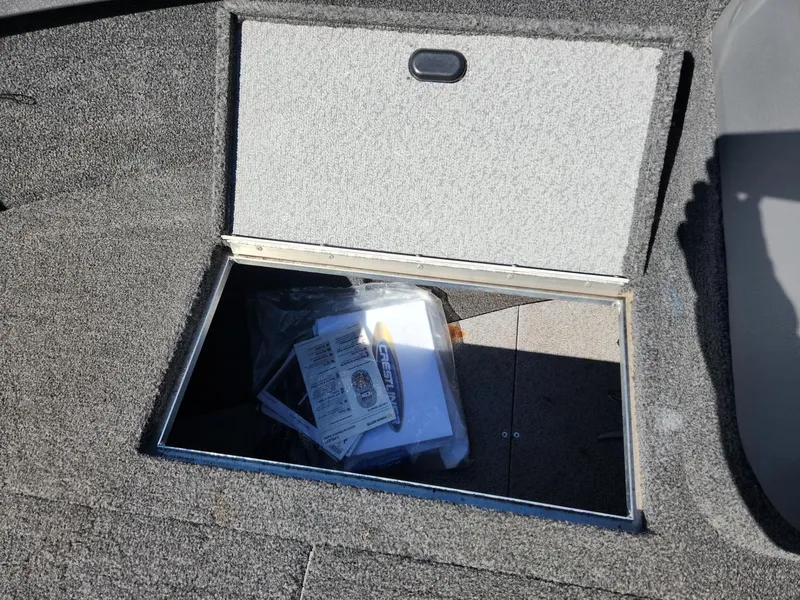 Slide: The Image of Crestliner 1650 Fish Hawk 2020 storage compartment with documents. - 20