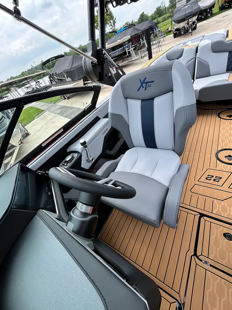 Slide: The Image of Interior of 2026 MasterCraft XT22 with modern steering wheel and seating. - 25