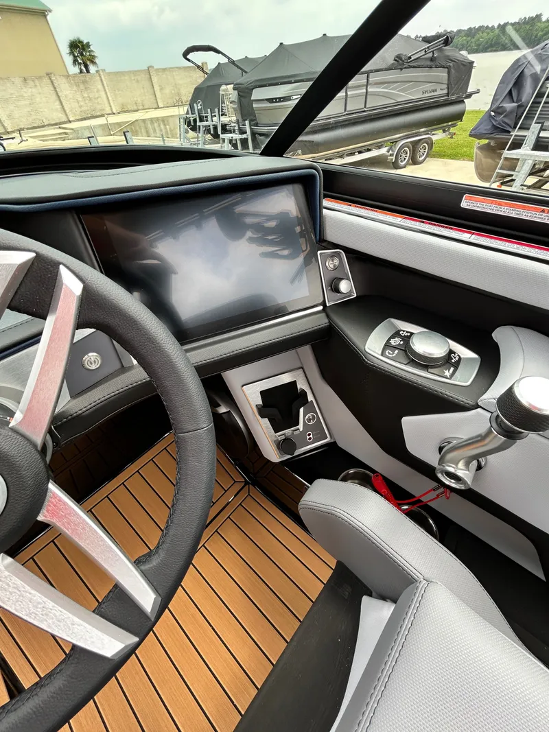 Slide: The Image of Interior of 2026 MasterCraft XT22 with modern dashboard. - 27