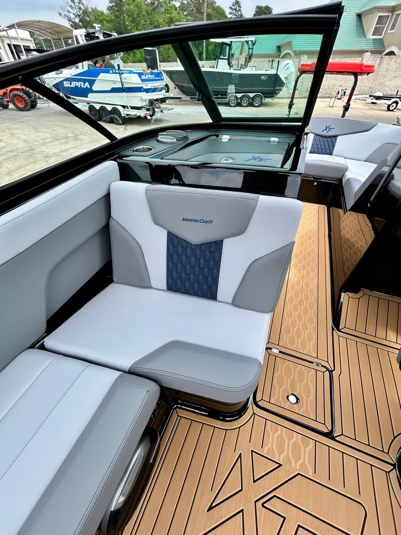 Slide: The Image of Interior of a 2026 MasterCraft XT22 boat with luxurious seating. - 31