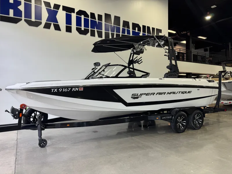 Slide: The Image of 2022 Nautique Super Air Nautique GS24 boat in showroom. - 3