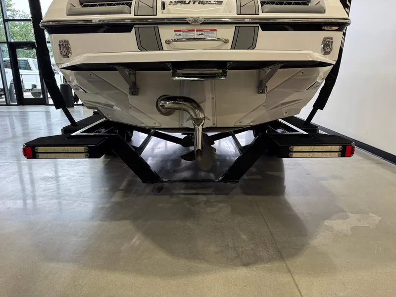 Slide: The Image of Rear view of a 2022 Nautique Super Air Nautique GS24 on a trailer. - 7