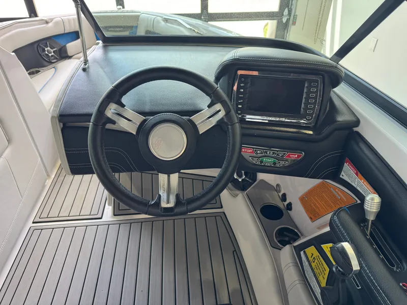 Slide: The Image of Interior view of 2014 Nautique Super Air Nautique 230 cockpit. - 25