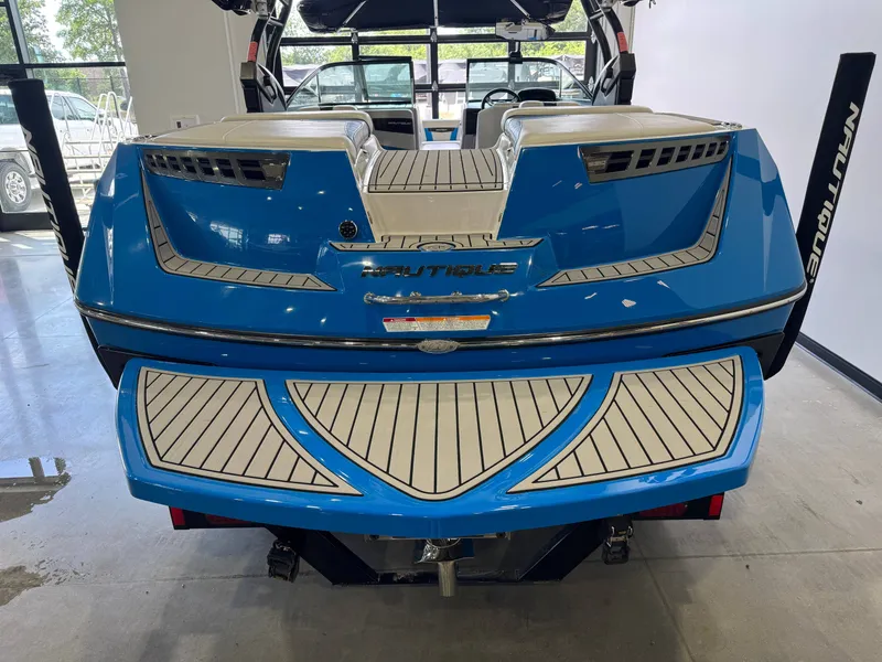 Slide: The Image of Rear view of a blue 2014 Nautique Super Air Nautique 230 boat. - 8