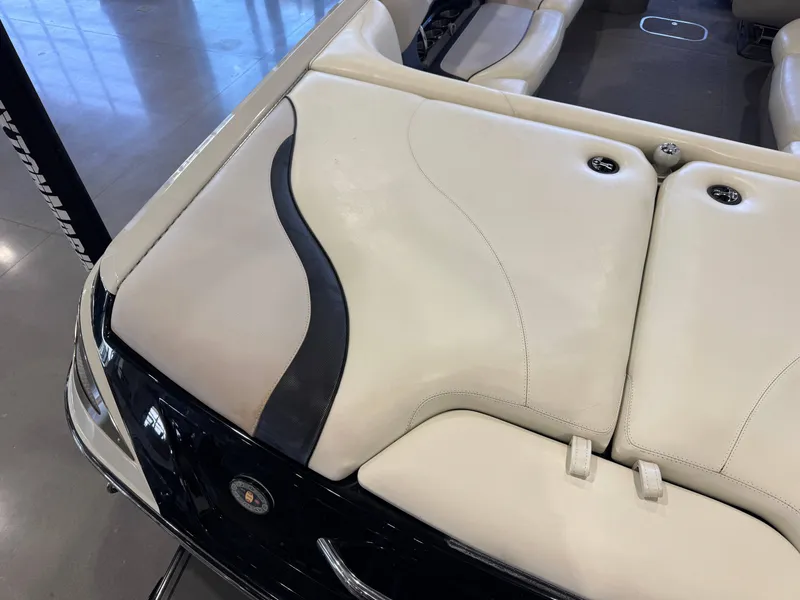 Slide: The Image of Interior of a 2006 Malibu 247 LSV boat with beige upholstery. - 12
