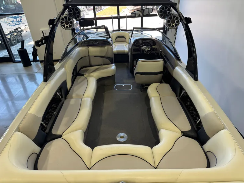 Slide: The Image of Interior of a 2006 Malibu 247 LSV boat with seating. - 13