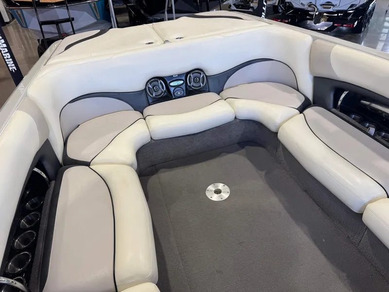 Slide: The Image of Interior of a 2006 Malibu 247 LSV boat with beige upholstery. - 16