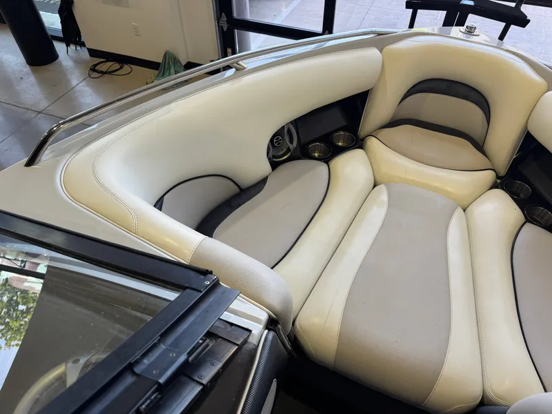 Slide: The Image of Interior of a 2006 Malibu 247 LSV boat with beige upholstery. - 19
