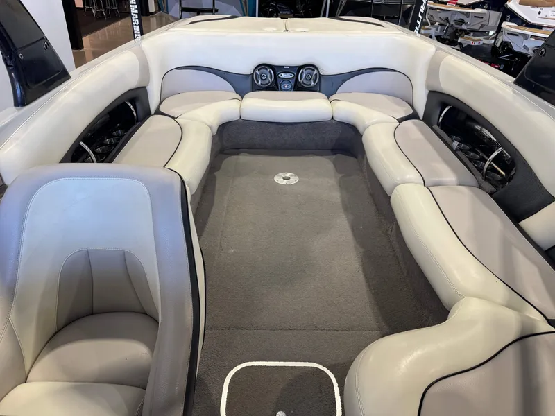 Slide: The Image of Interior of a 2006 Malibu 247 LSV boat with gray upholstery. - 22