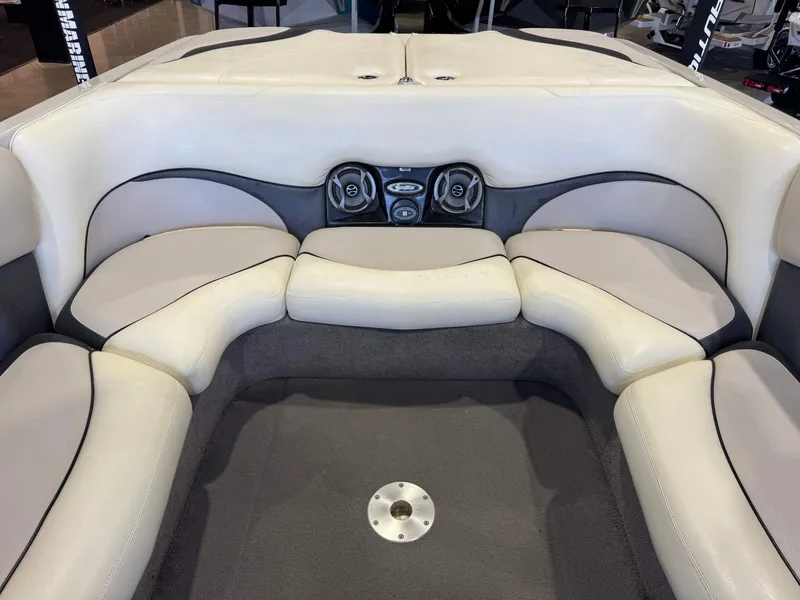Slide: The Image of Interior of a 2006 Malibu 247 LSV boat with seating area. - 26