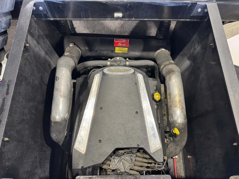 Slide: The Image of Engine compartment of a 2006 Malibu 247 LSV boat. - 27