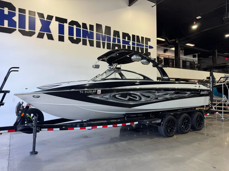 Slide: The Image of 2006 Malibu 247 LSV boat in showroom at Buxton Marine. - 3