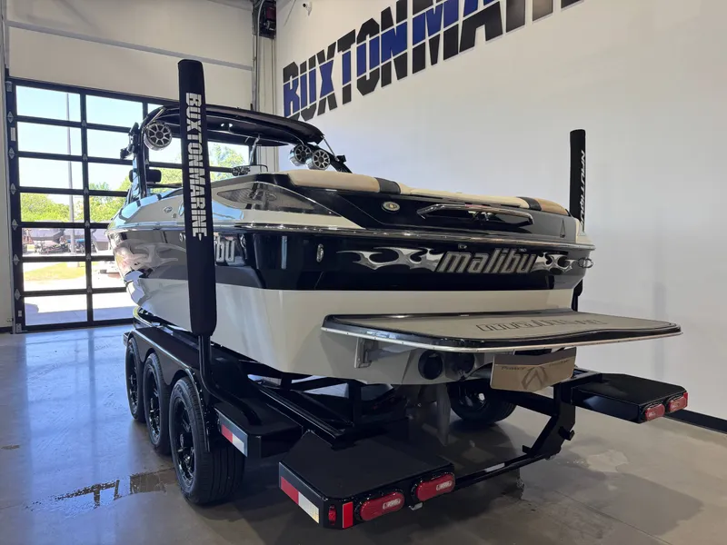 Slide: The Image of 2006 Malibu 247 LSV boat in a garage at Buxton Marine. - 5
