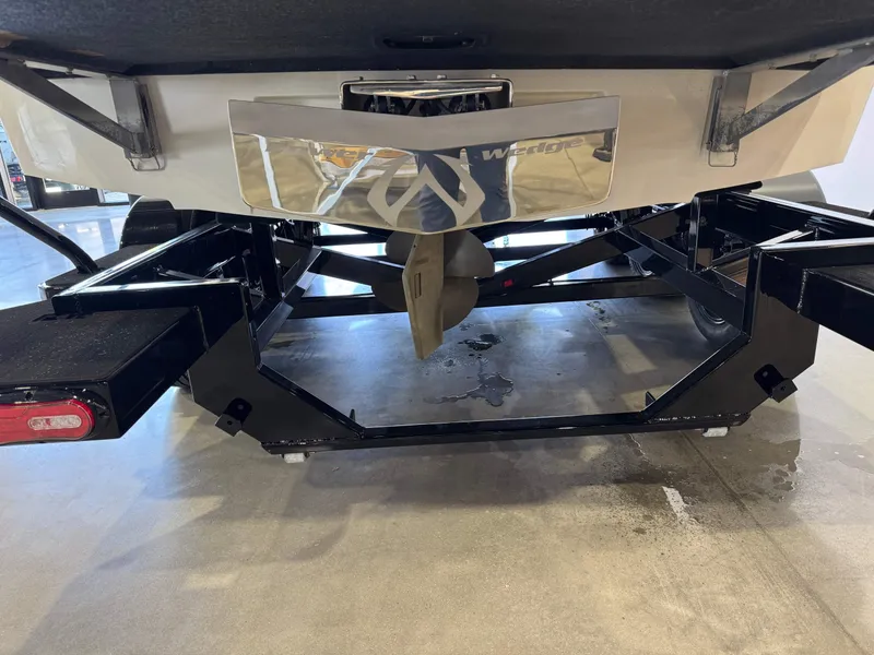Slide: The Image of Rear view of a 2006 Malibu 247 LSV boat on a trailer. - 7