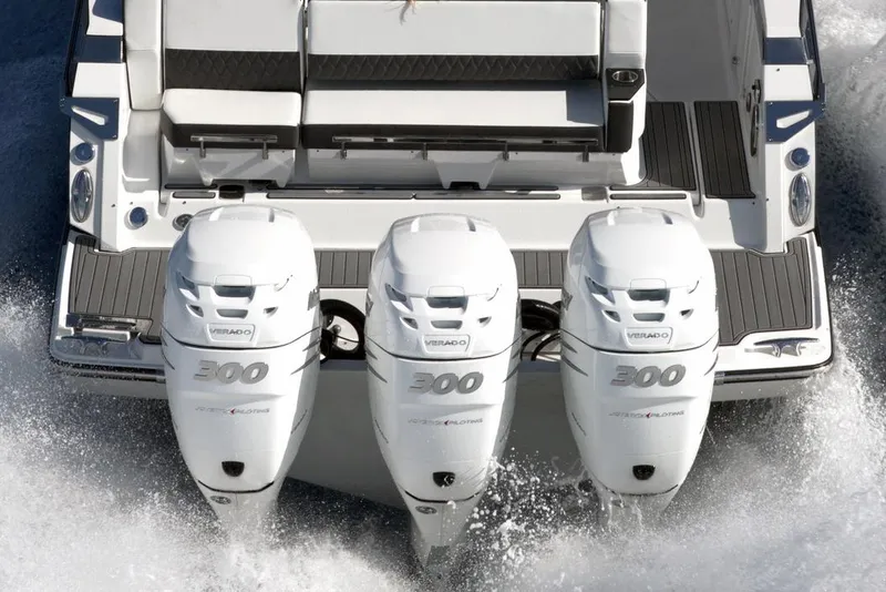 Slide: The Image of Manufacturer Provided Image: 2025 Monterey 385SS Super Sport boat with triple outboard engines on water. - 2