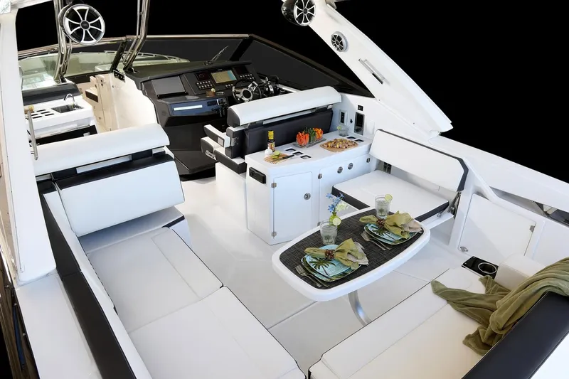 Slide: The Image of Manufacturer Provided Image: 2025 Monterey 385SS Super Sport luxury boat interior with elegant seating and dining area. - 7