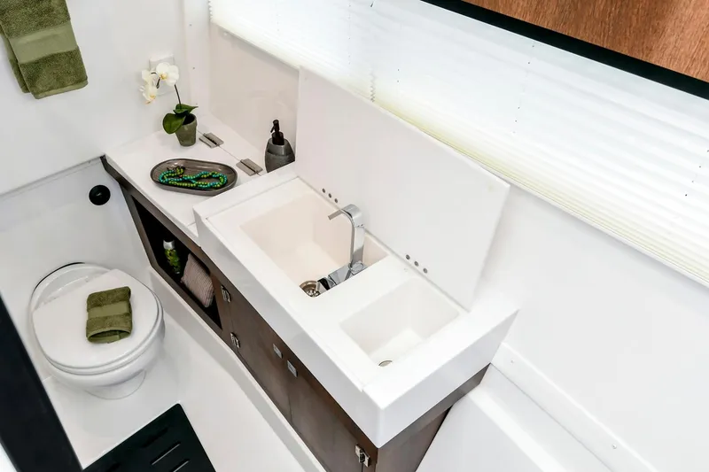 Slide: The Image of Manufacturer Provided Image: Luxurious bathroom in 2025 Monterey 385SS Super Sport boat with modern sink and toilet. - 8