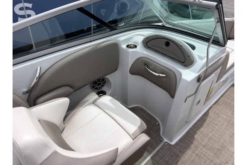 Slide: The Image of Interior of 2018 Crownline Eclipse E215 XS boat, featuring seating and storage. - 11