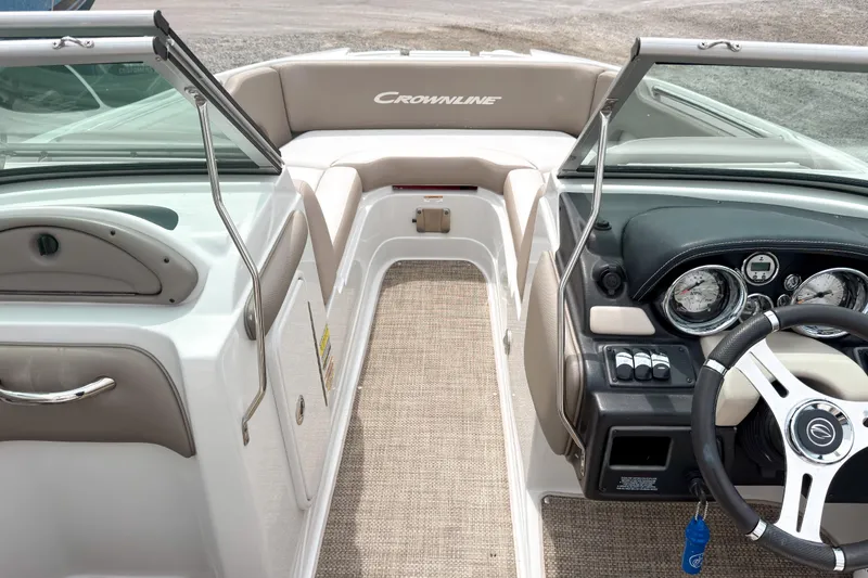 Slide: The Image of 2018 Crownline Eclipse E215 XS boat interior with steering wheel and dashboard. - 7