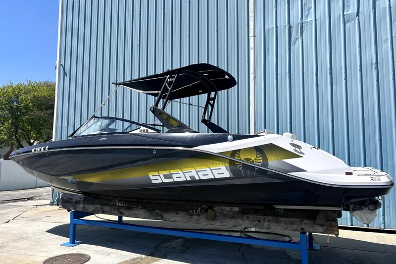 The Image of 2017 Scarab 255 H.O. Impulse boat on display, featuring sleek design and vibrant graphics. - 0