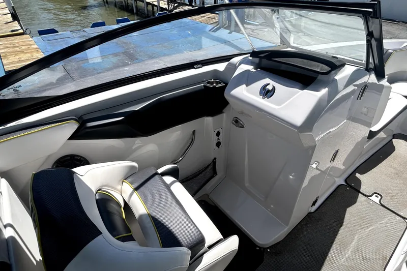 Slide: The Image of 2017 Scarab 255 H.O. Impulse boat interior with sleek seating and dashboard design. - 11