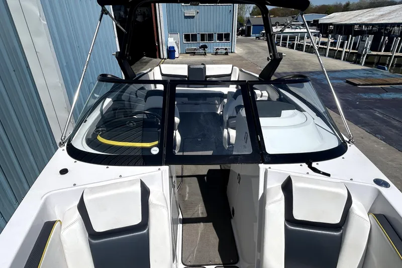 Slide: The Image of 2017 Scarab 255 H.O. Impulse boat interior with sleek seating and modern design. - 12