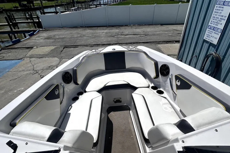 Slide: The Image of 2017 Scarab 255 H.O. Impulse boat interior with white seating and cup holders. - 13