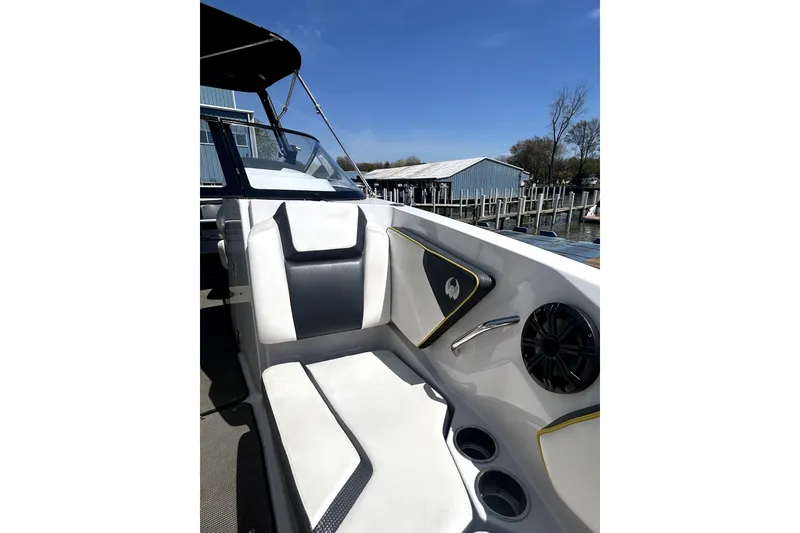 Slide: The Image of Interior view of 2017 Scarab 255 H.O. Impulse boat with white seating and speaker. - 14