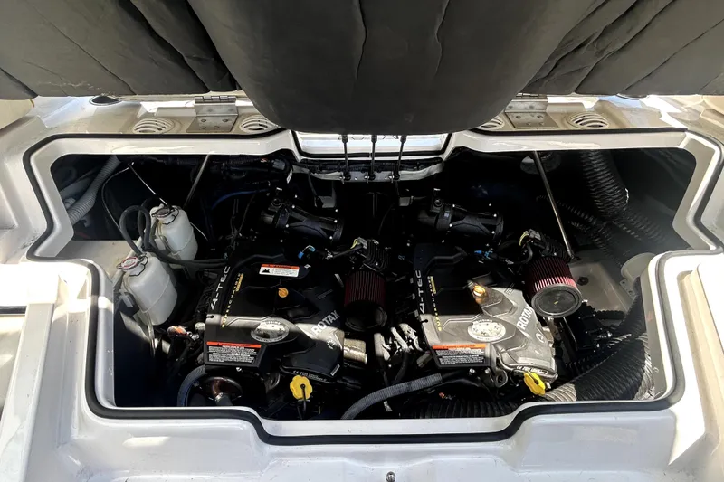 Slide: The Image of Engine compartment of a 2017 Scarab 255 H.O. Impulse boat, showcasing Rotax engines. - 21