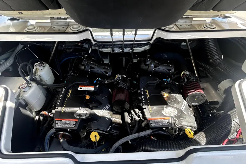 Slide: The Image of Engine compartment of a 2017 Scarab 255 H.O. Impulse boat, featuring dual Rotax engines. - 22