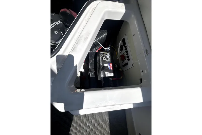 Slide: The Image of Battery compartment of a 2017 Scarab 255 H.O. Impulse boat. - 24