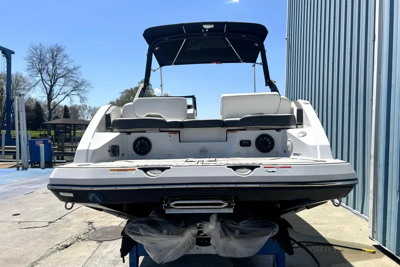 Slide: The Image of 2017 Scarab 255 H.O. Impulse boat at dockside, rear view with seating and speakers. - 4