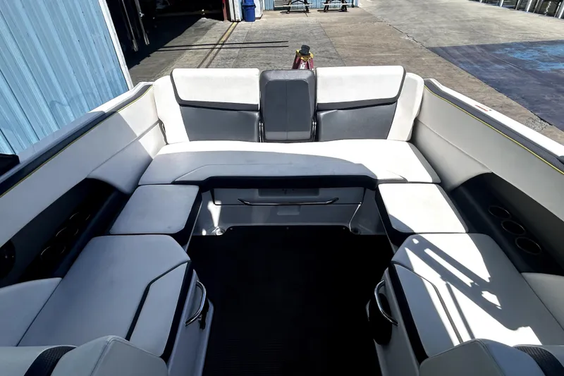Slide: The Image of Interior seating of 2017 Scarab 255 H.O. Impulse boat, featuring spacious, cushioned layout. - 7